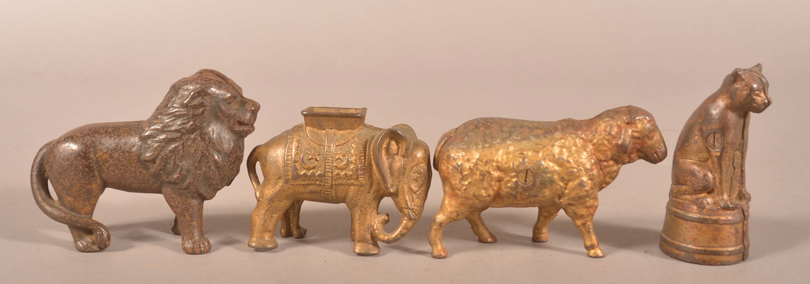 Four Antique Cast Iron Animal Still Banks. (1 of 3)