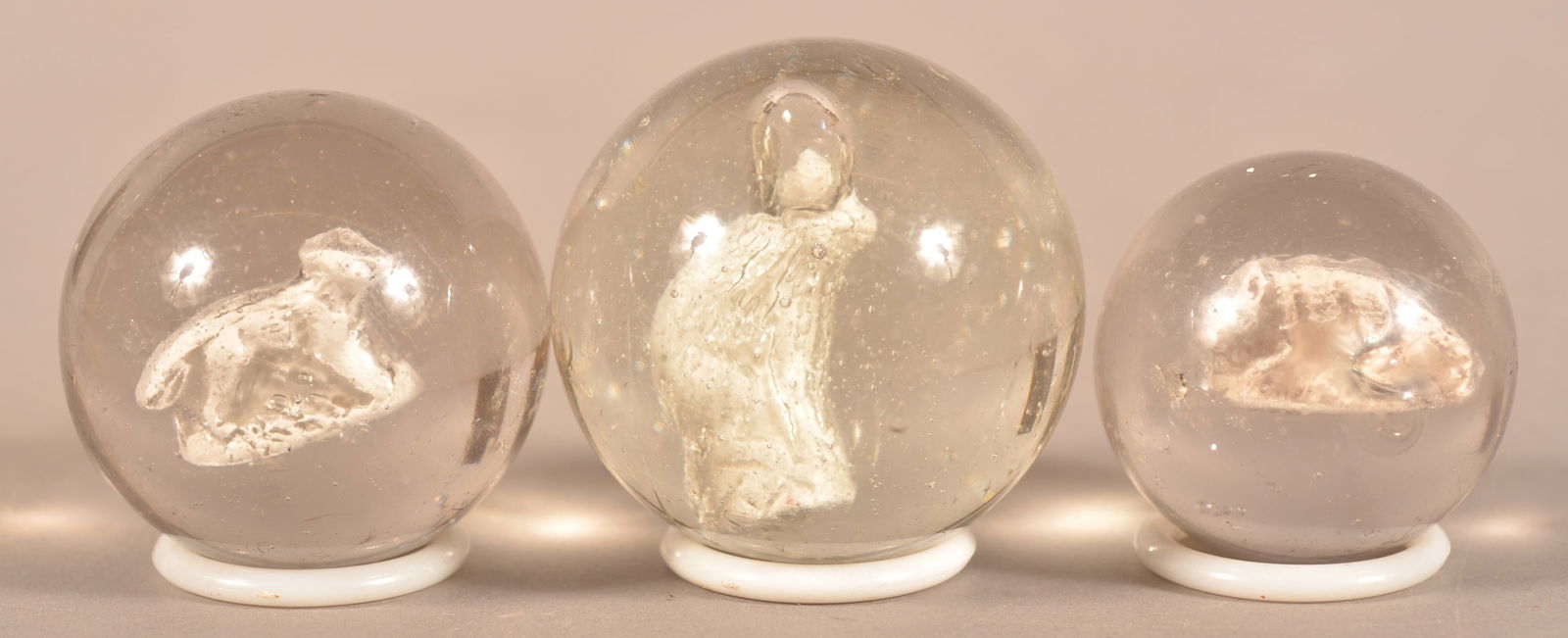 Three Antique White Sulphide Marbles.: All are full-bodied fox figures in different poses. Largest, 1-3/4" diam.