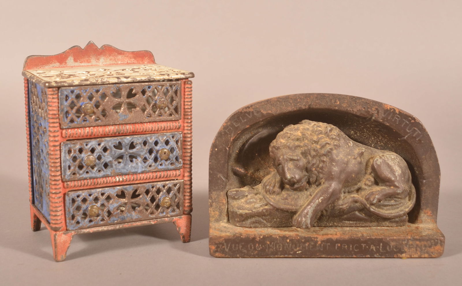 Chest of Drawers Bank & Lion of Lucerne Bookend.: J & E Stevens cast iron chest of drawers still bank and Lion of Lucerne Bookend. Chest, 6-1/4"h. x 4-3/4"w. x 3-1/2"d.; Lion, 5"h. x 7-1/4"w. x 2-1/4"d.