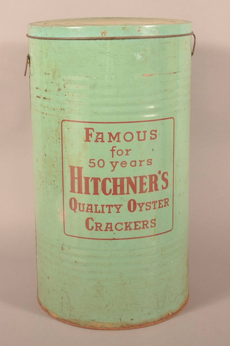 Hitchner's Oyster Cracker Advertising Canister.: Light blue tin with red lettering. 27-1/4"h. x 15-1/4" diam.
