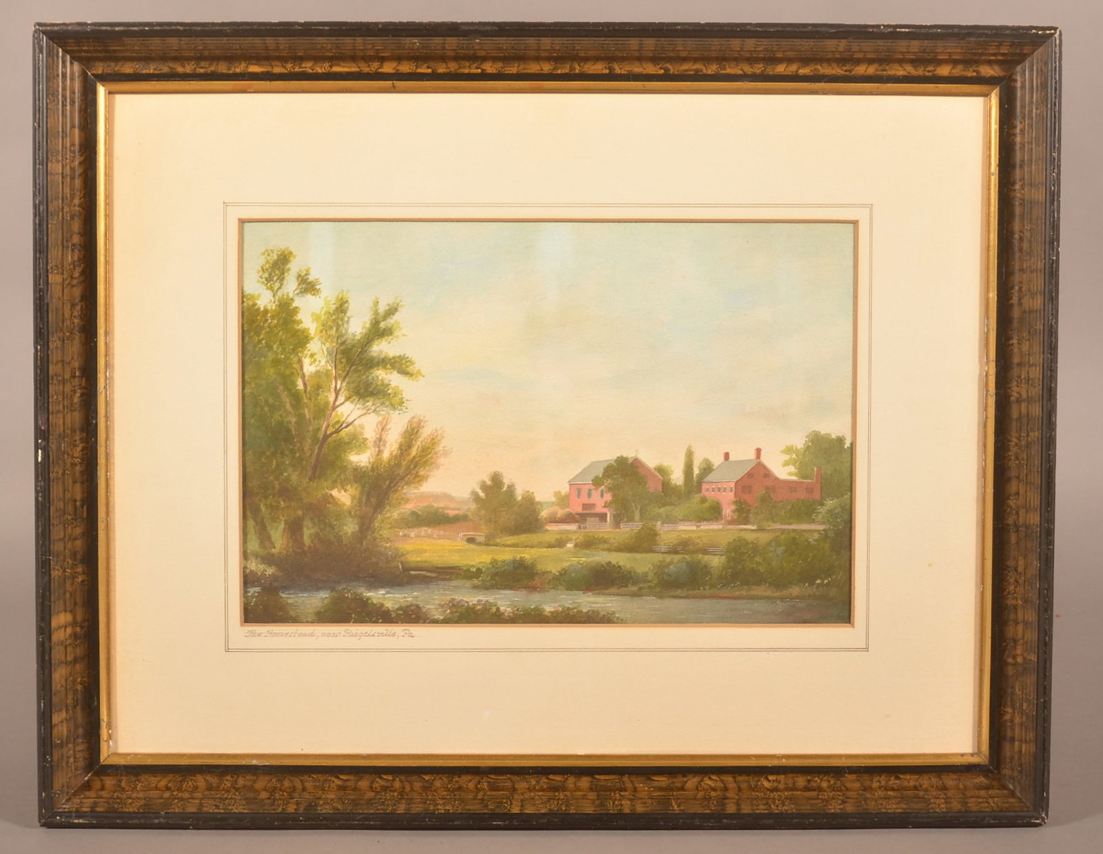 Antique Bucks County ,PA Watercolor Landscape.: Unsigned. Titled on matting lower left "The Homestead near Riegelsville, Pa". Depicts a farmstead scene with rolling hills and stream. Matted and framed. 18-3/4" x 23-3/4" overall.