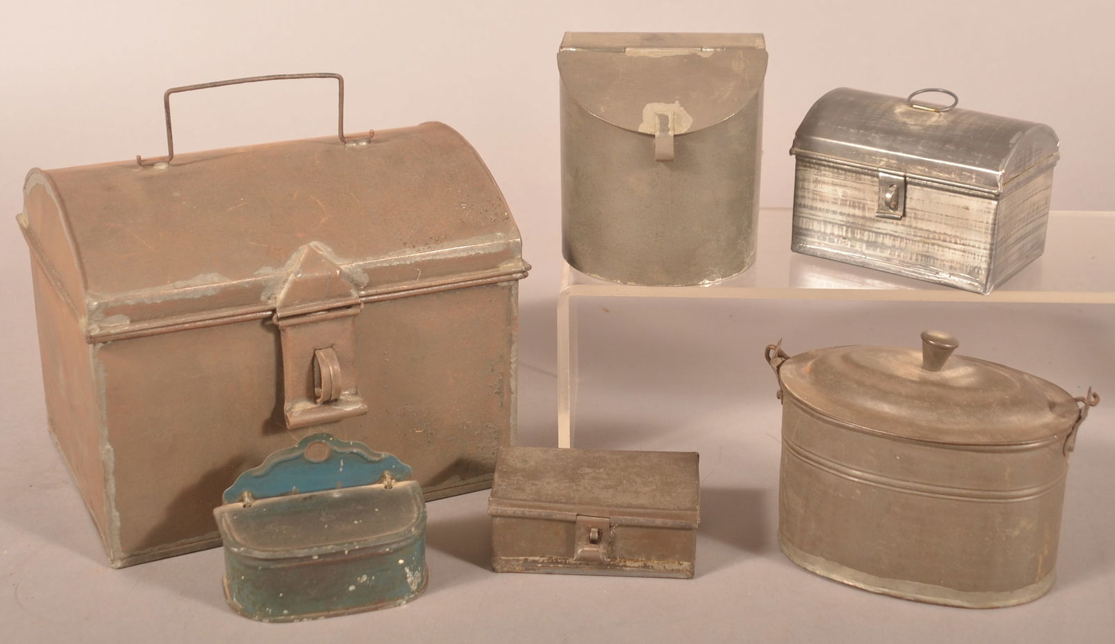 Six Pieces of PA 19th C. Tin Utilitarian Wares.: Including dome-lid trinket boxes, spice containers, matchbox, and small pail. Largest box, 6-1/2"h. x 8"w. x 6-1/2"d.