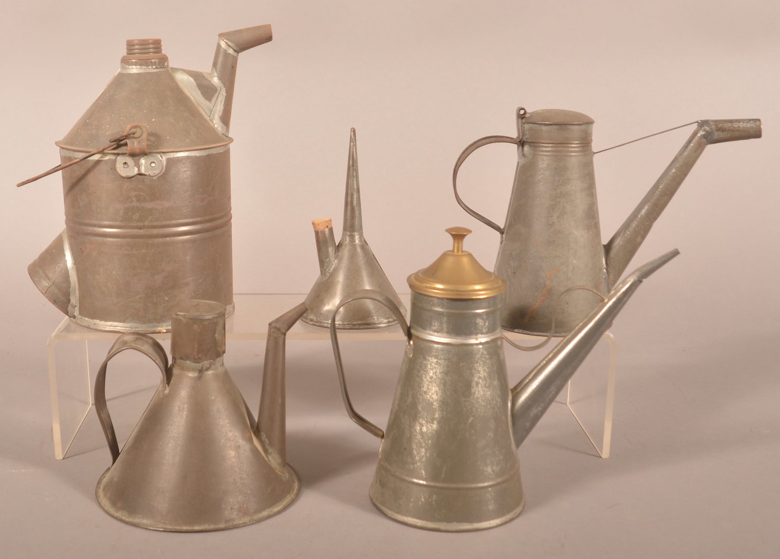 Five Antique Tinware Oil Cans and Lamp Fillers.: Largest embossed P. & R. One lamp filler has a brass lid. Largest, 9"h. x 5" diam.