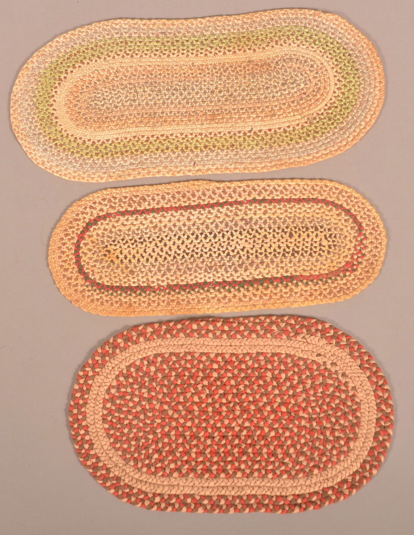 Three Oblong Multi-Colored Braided Table Mats. (1 of 2)