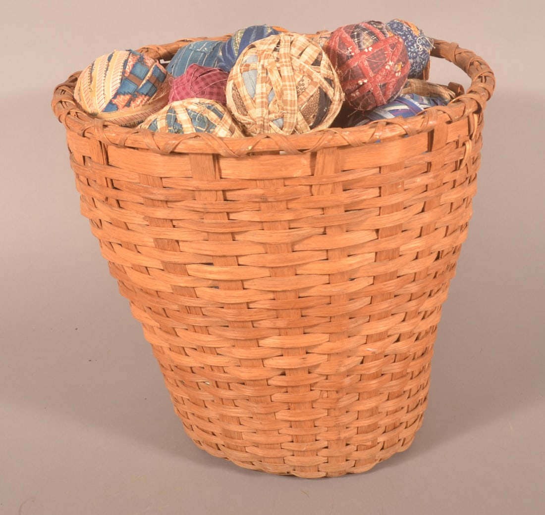Antiq. Splint Field Basket Filled w/ Fabric Balls.: Various colored vintage fabric balls. Basket 14"h. x 16" diam.