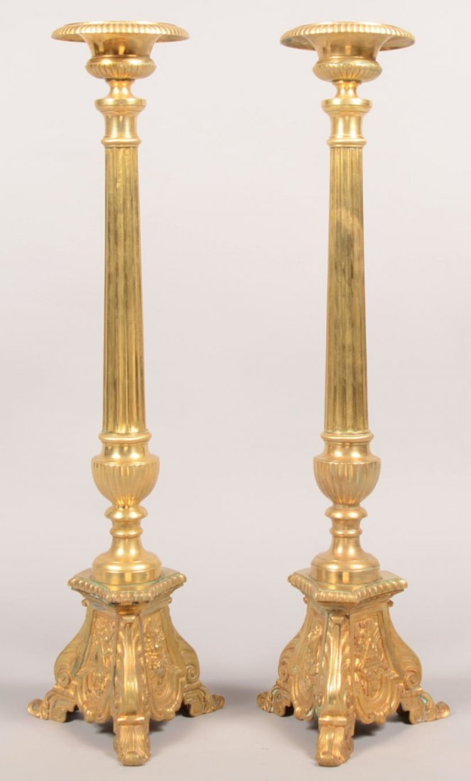 98. Pair of Victorian Brass Church Altar Candlesticks. : 98. Pair of Victorian Brass Church Altar Candlesticks. Urn form receptacles, fluted column pedestals and acanthus leaf and scrolled tripod bases with embossed religious medallions. 28" high. Condition