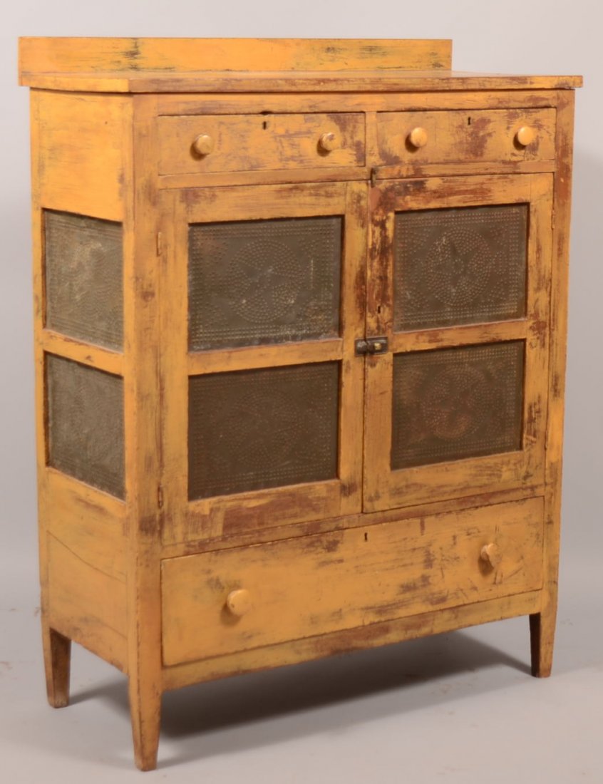 271. 19th Century Yellow Painted Walnut Punched Tin Pie: 271. 19th Century Yellow Painted Walnut Punched Tin Pie Safe. Two split upper dovetailed drawers above two double tin paneled doors and sides, lower full width dovetailed drawer and tapered feet. Tin