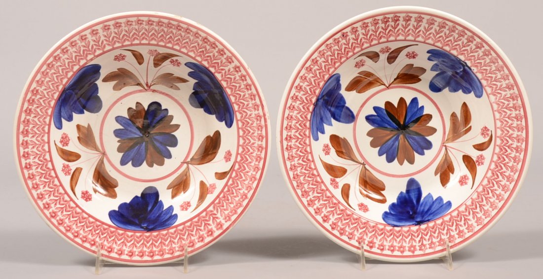 335. Two Matching Pattern Cut-Sponge Ironstone China So: 335. Two Matching Pattern Cut-Sponge Ironstone China Soup Plates. Marked "Made in Belgium". Red floral border with central cobalt blue and brown brushed flowers and leaves with red stamped florets. 11