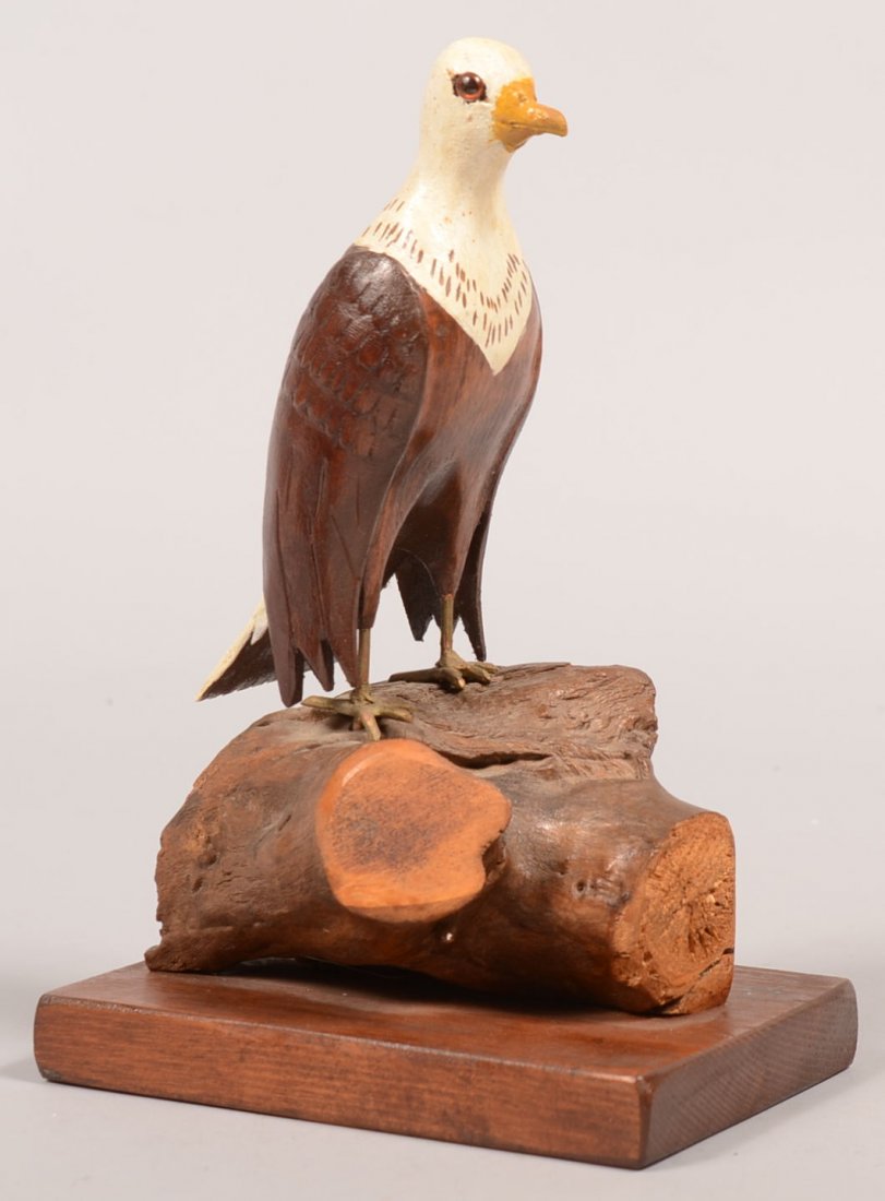 404. 20th Century Folk Art Carved Wood Figure of an Eag: 404. 20th Century Folk Art Carved Wood Figure of an Eagle. Unsigned. Full bodied American bald eagle with painted details, perched on a stump and mounted on a wood rectangular base. 9"h. Condition: Ve