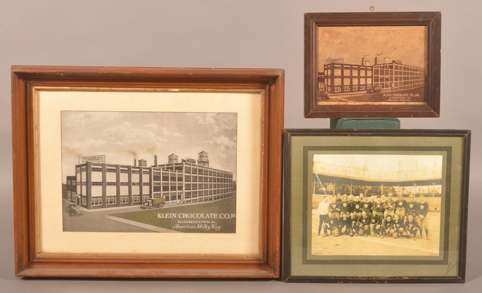 Klein's Chocolate Photo Collection.: Three framed photos. One of the factory titled "America's Milky Way", one a copy photo of the company football team, and a large enhanced photo of the factory. Provenance: James Hoffman Collection. La