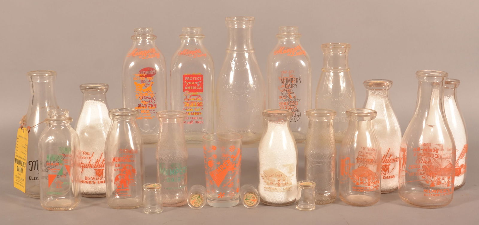 Excellent Collection Mumper's Dairy Milk Bottles.: Sixteen milk bottles.....all are different variations. One milk glass and four creamers. Great opportunity to get a large collection for one bid. Provenance: James Hoffman Collection. Largest bottle,