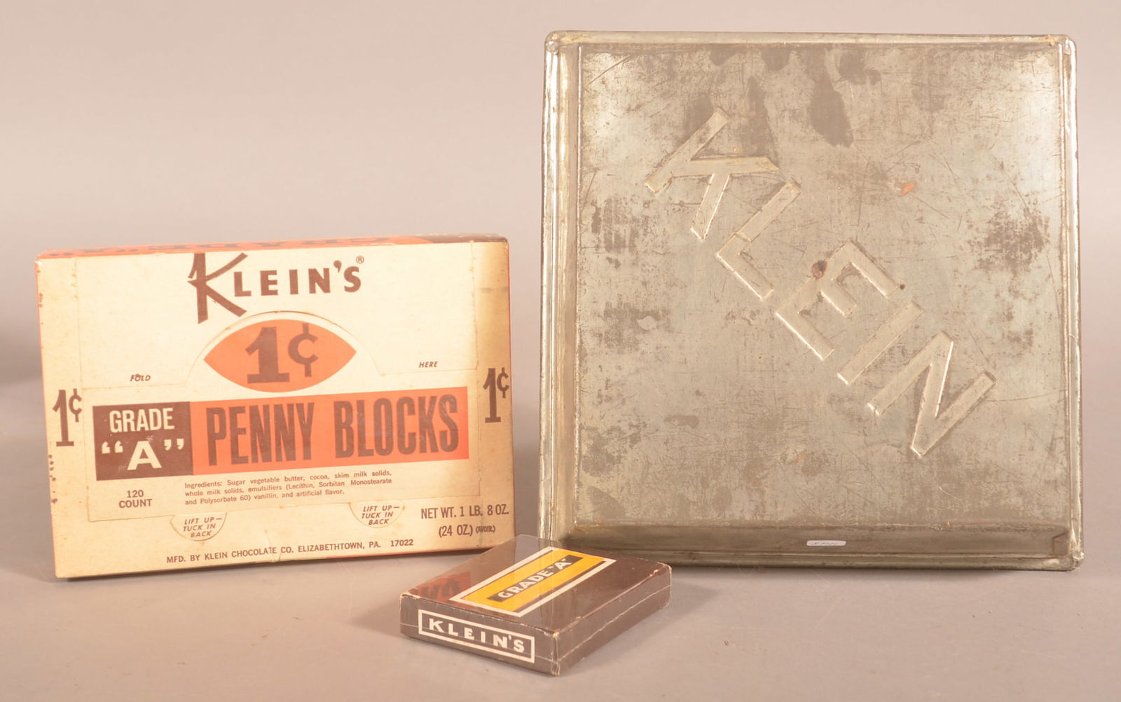 Two Klein's Grade "A" Chocolate Boxes & Baking Pan.: Two cardboard boxes for Klein's including a 1c display box and a small embossed Klein's baking pan. Provenance: James Hoffman Collection. Pan, 2"H x 11"W