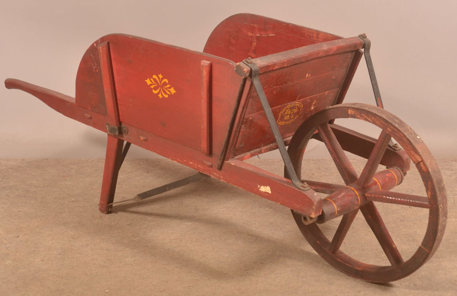 Buch No. 3 Painted & Stenciled Wheelbarrow.: Very nice size No. 3, stenciled on front board with Buch and Elizabethtown, PA. Earlier version with wood front wheel and removable sides. Provenance: James Hoffman Collection. 25"H x 65"L x 21-1/2"W