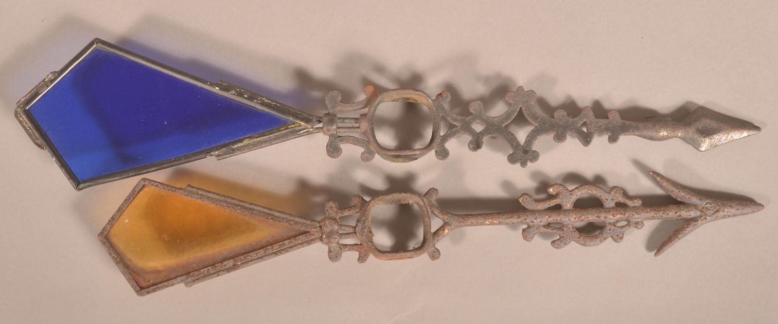 Two Colored Glass Weathervane Directionals. (1 of 2)