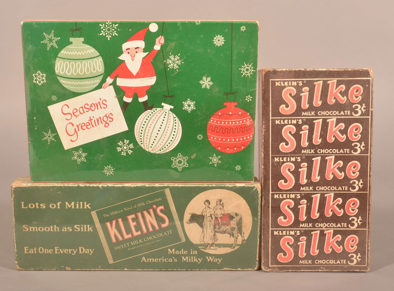 Three Klein's Chocolate Cardboard Display Boxes.: Silke, Sweet Milk Chocolate and a Christmas Special Box. Provenance: James Hoffman Collection. Largest, 6-3/4"H x 9-1/2"W x 1-1/4"D
