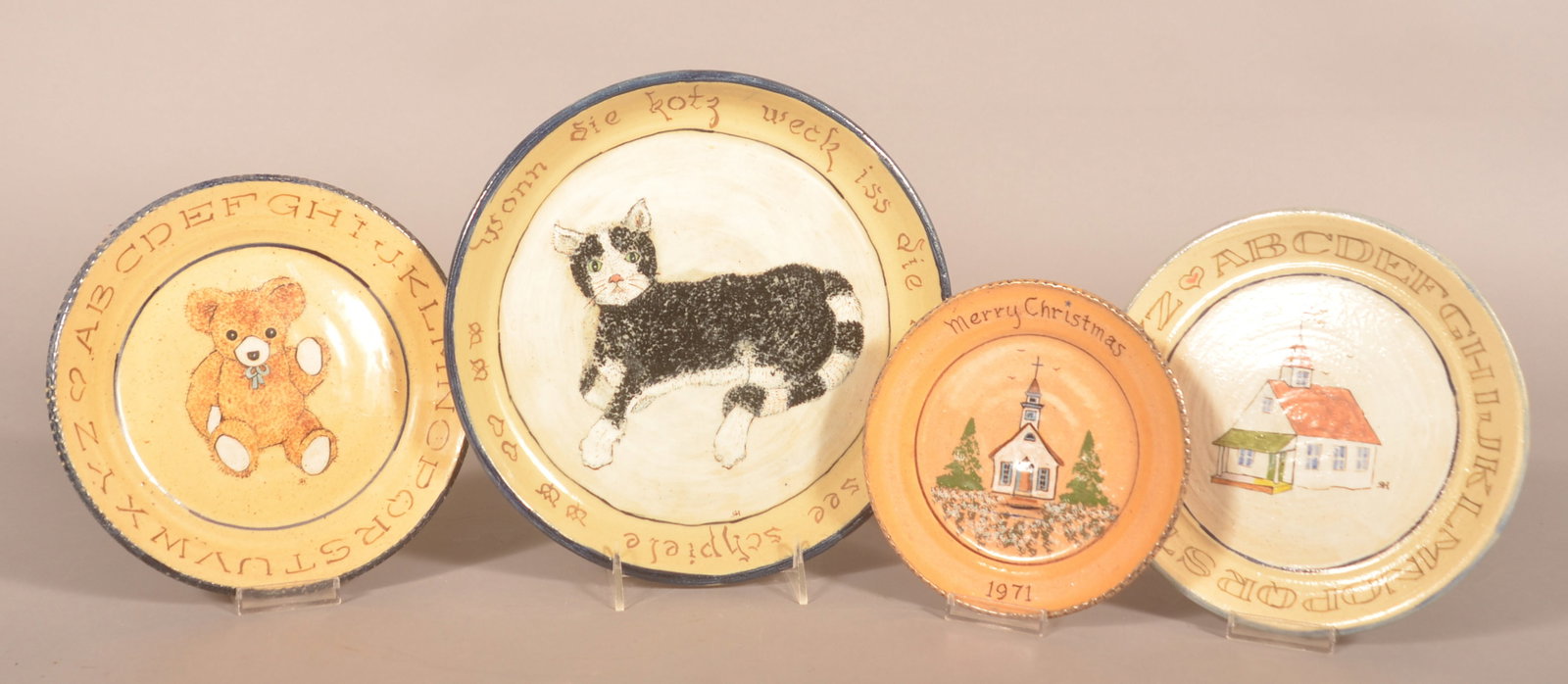 "Left Handed" Russell Henry Hand-Decorated Plates: Hay Creek Pottery was located in Birdsboro, Berks County. 4 plates, each signed and dated on the base with wonderful painted designs including a Church with Merry Christmas, a schoolhouse with a US Fl