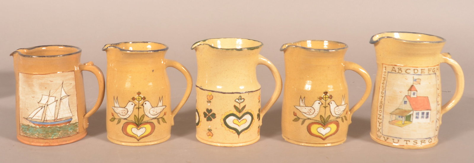 Decorated "Left Handed" Russell Henry Pitchers (1 of 3)
