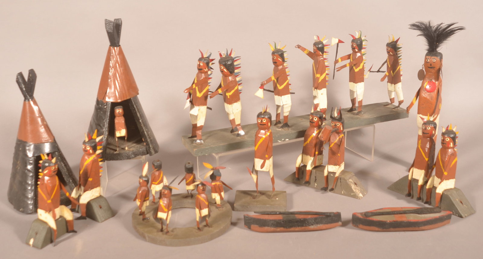 Great Folk Art Tin & Wood American Indian Village: Wonderful form, 1920s-1930s, made from scrap tin and wood. 2 canoes, 2 teepees, very large standing Chief, 6 armed braves on a board, 6 braves on a circular board, 1 standing armed brave, 6 seated bra