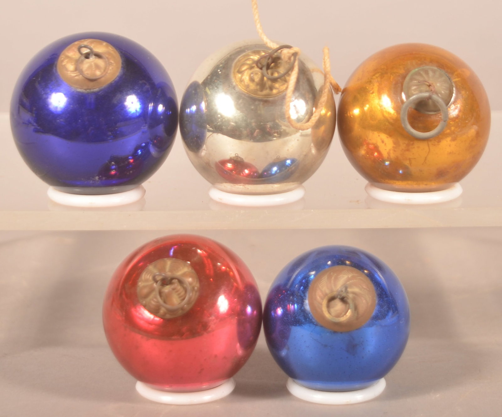 Small Group Christmas Glass Kugels: 5 different color, similar size glass kugels with embossed tin caps. Purple, blue, gold, silver and red. Red with a pontiled base. 1 3/4"D