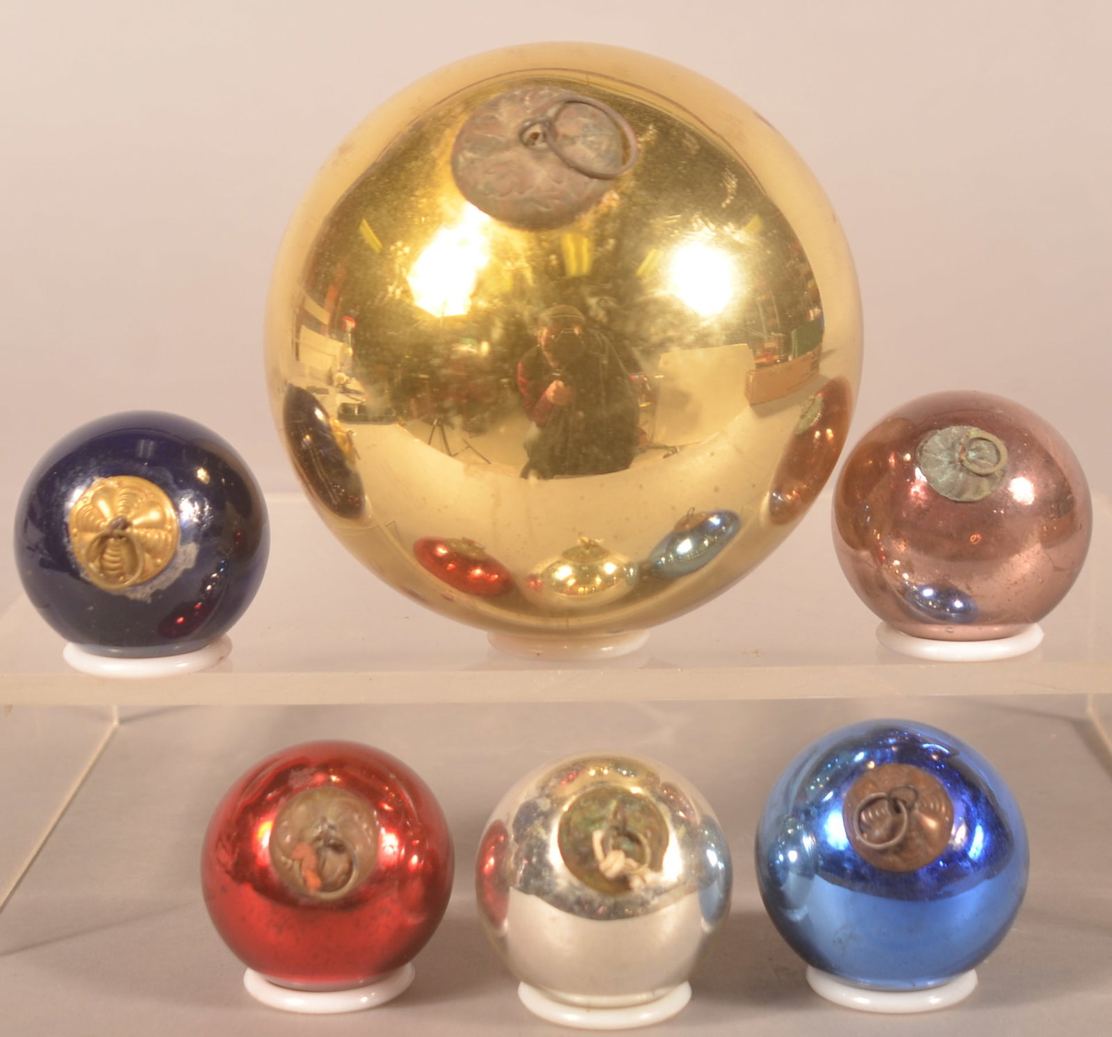 Antique German Christmas Tree Glass Kugels: 1 large gold kugel with a round, pontil-type mark on the base and 5 smaller kugels. Gold, pink, red, silver and two shades of blue. Largest, 3 3/4"D. Small, 1 1/2"D