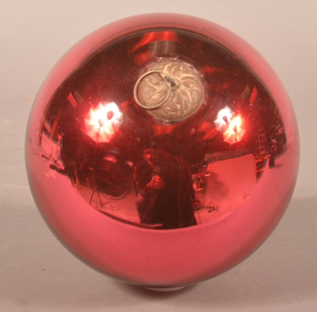 Large 5 1/4" Ruby Red Christmas Kugel: Excellent large German kugel with embossed tin cap and nice swirled imperfections in the glass from the making process. 5 1/4"D