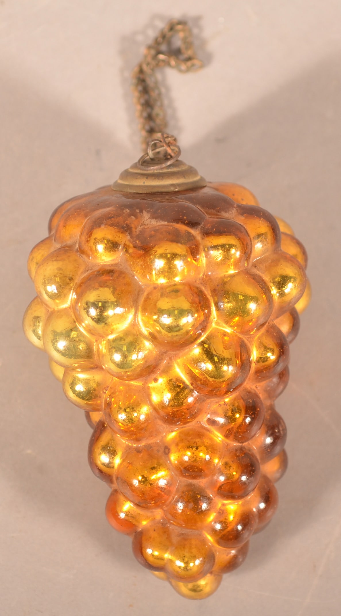 Excellent Amber Grape Cluster German Kugel: Wonderful colors with a concentric shaped metal cap and a great twisted brass hanging chain that is period. 4"L
