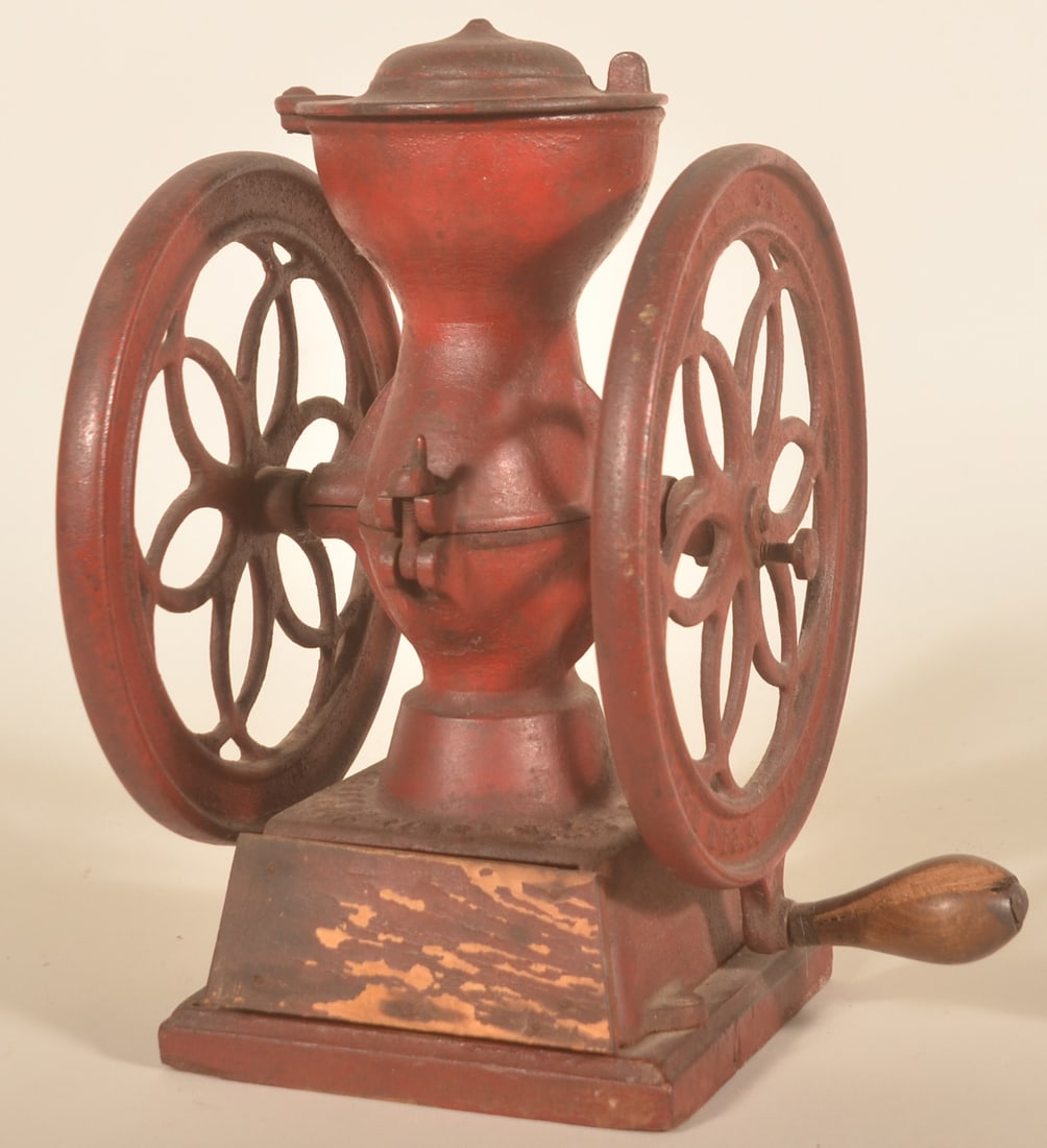 Small Enterprise Double Wheel Coffee Grinder: General store counter size with wood handle. Later red paint has good age. Original wood base. Wood drawer front in matching red might be a replacement as these were typically cast iron. 12 3/4"H. 8 3
