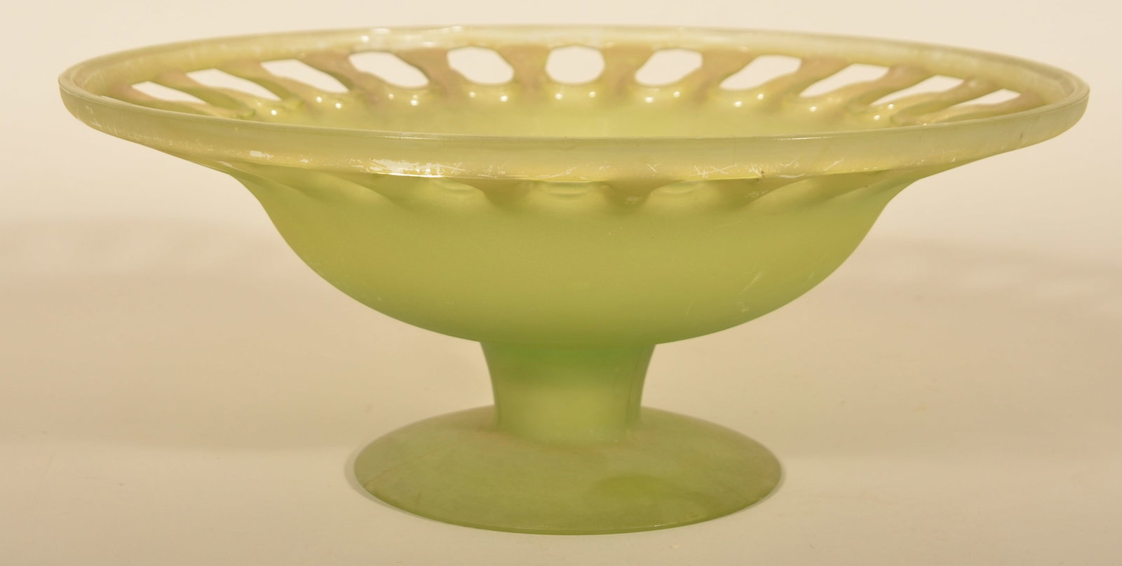 Unusual Large Green Art Deco Glass Footed Bowl: Vaseline glass bowl with cut-outs along the top border. Great appearance. 7"H x 16 1/8"D