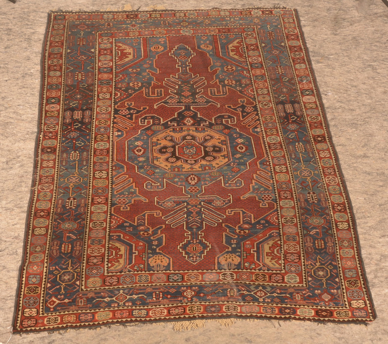 Antique Woven Persian Rug: Geometric pattern. Professional cleaning tag on reverse indicating it was cleaned in Reading, PA in 1957. 54" x 69"