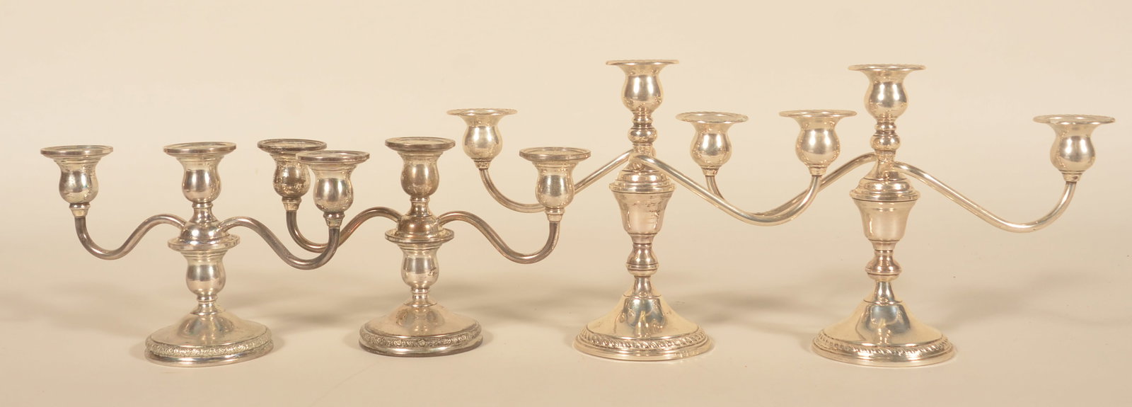 4 Preisner Sterling Silver Candleabras: Each is 2-piece with the candleholder screwing in to the weighted base. 2 different sizes. Made in France. Taller, 8 1/2"H x 12"W. Smaller, 6 1/4"H x 10"W