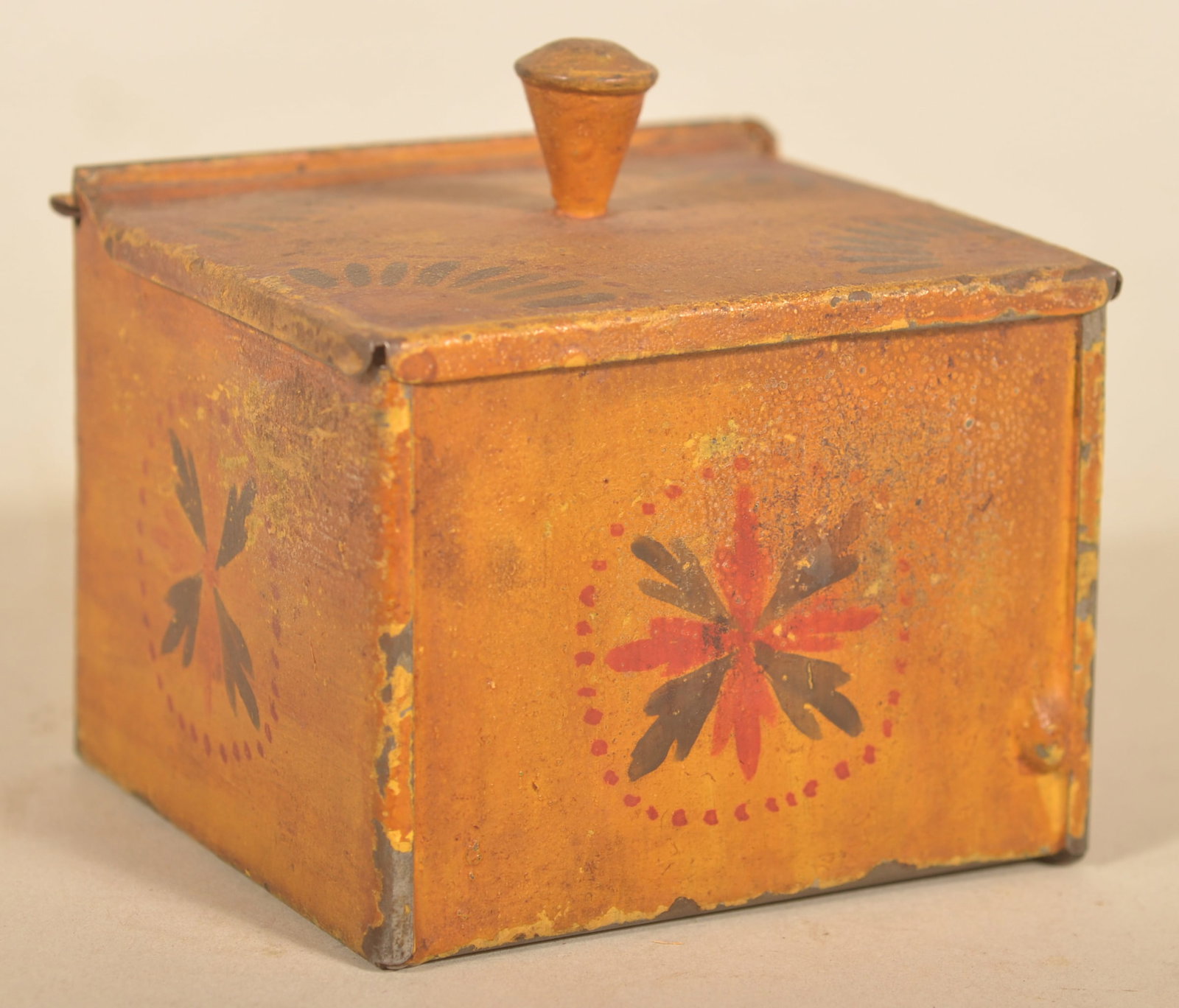 PA Tin Lift-Lid Ochre Paint-Decorated Box: One of the best items in a sale filled with many great things. An excellent small tin lift lid spice box with a ground ochre base paint with red and black painted decoration. This was consigned from a