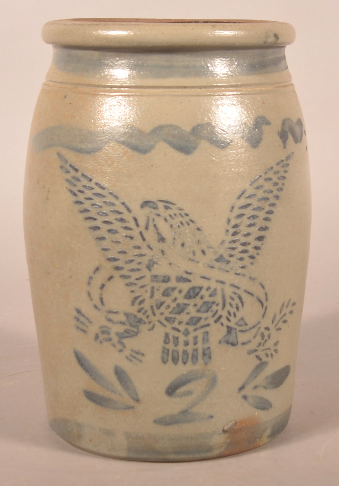 2-Gallon Western PA Stenciled Eagle & Shield Crock: Attributed to T.F. Reppert, Greensboro, PA, ca. 1876. More difficult to find eagle stencil variation with the shield inside the breast with 13 dots representing the original colonies. Eagle looking to
