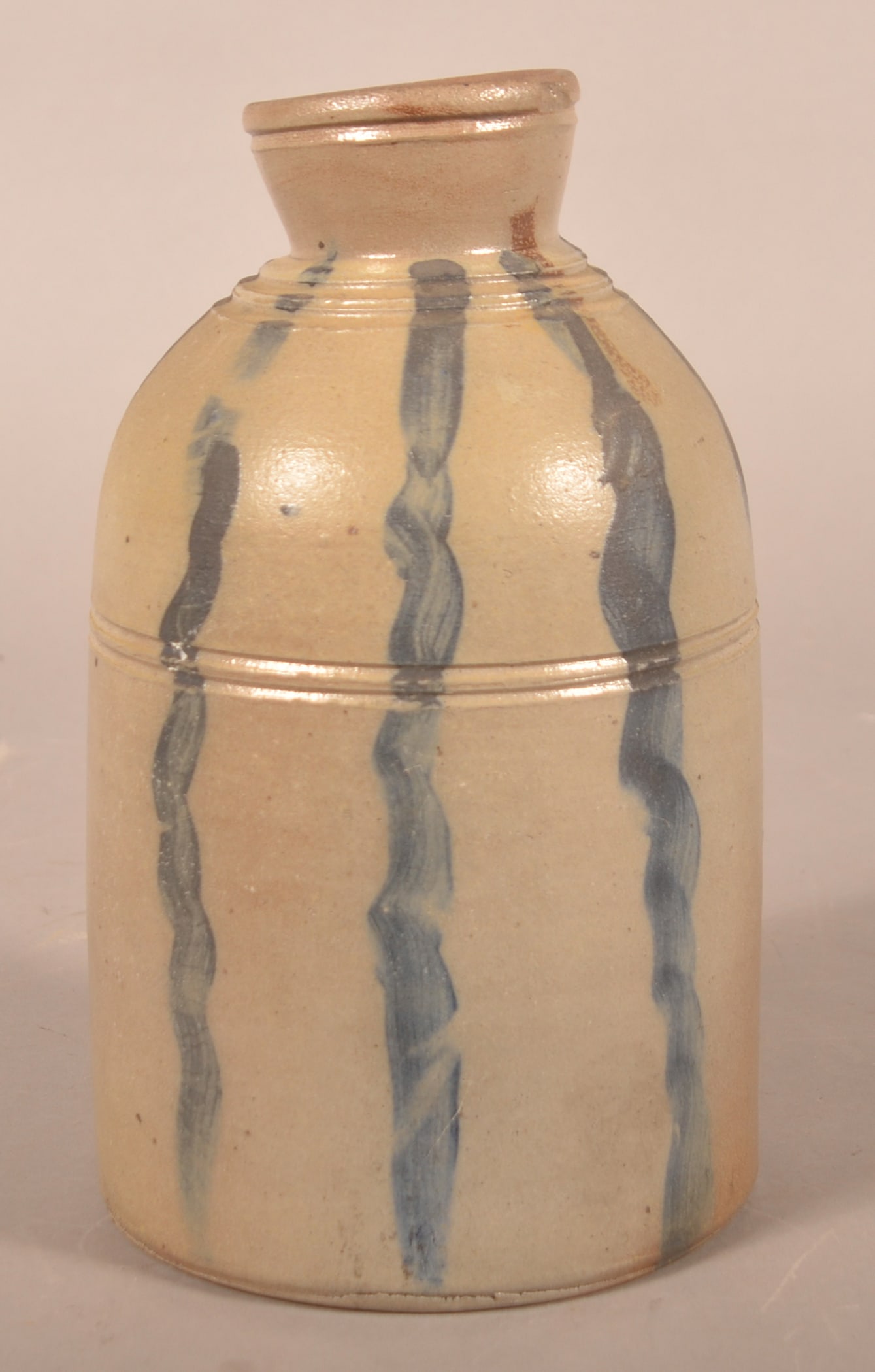 Rare Western PA Watermelon Vertical Stripes Crock: An extraordinary find and a highlight of the auction is this early Greensboro oyster/tobacco stoneware jar with vertical freehand stripes. Possibly James Hamilton. One of a very few vertical stripe ja