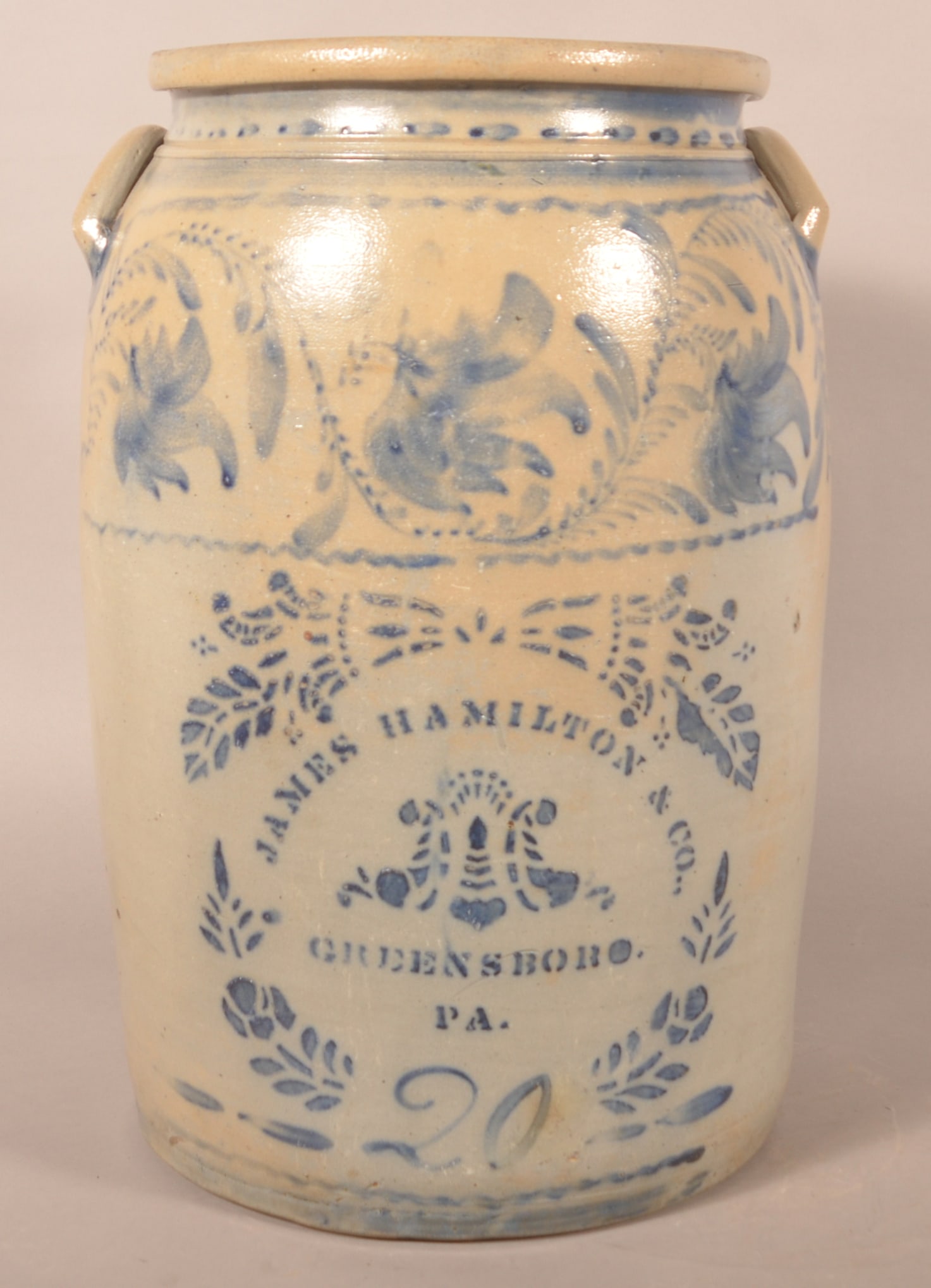 Fantastic James Hamilton 20-Gallon Freehand Crock: Another highlight of the sale is this profusely decorated 20-gallon jar, ca. 1870. Wonderful combination of freehand and stencil with excellent contrast between the blue and the grey. Stenciled "James