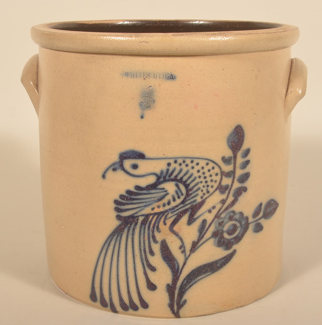Large Whites Utica 3-Gallon Bird on Flower Crock: Straight-sided jar from Utica, NY. Civil War period. Strong blue freehand decoration of a "turkey in the wind" with a fan-shaped tail perched on a branch with flowers. Very nice example from this pott