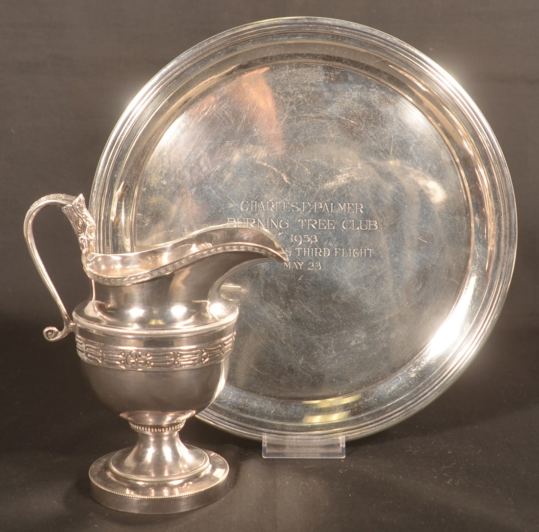 Sterling Silver Creamer Pitcher and Plate: Creamer marked "Sterling" on base with the initials "CB" on the outer ring on the underside. Though different pattern possibly related to Lots 469 and 470. Serpent handle and art deco design on the bo