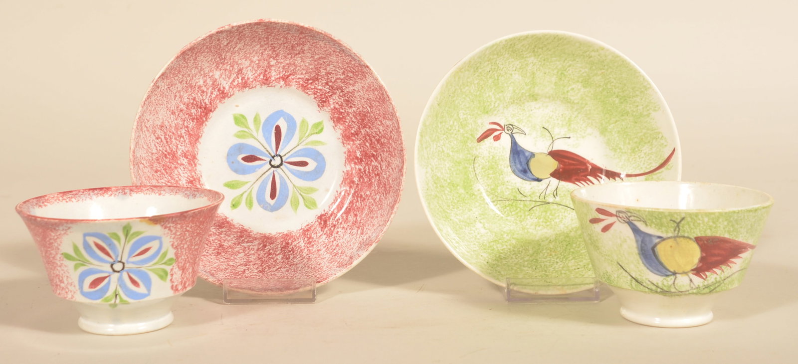 2 Spatterware Handleless Cups & Saucers: Both early examples, 1830-1840, with bright colors. 1 with peafowl decoration and the other with a floral pattern. With saucer, 2 1/2"H