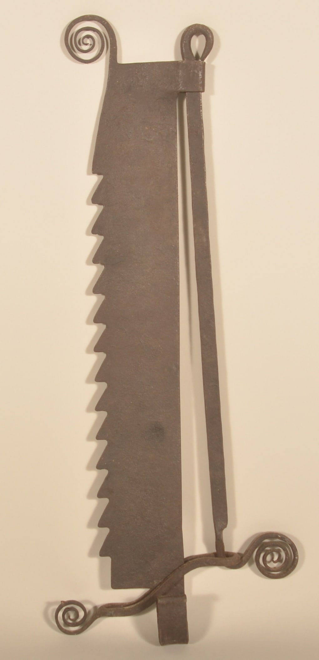 Antique Wrought Iron Fireplace Trammel: Wonderful form with watchspring embellishments, deep sawtooth edge and a rattail hanger. 18th/19th century. 26 1/2"H