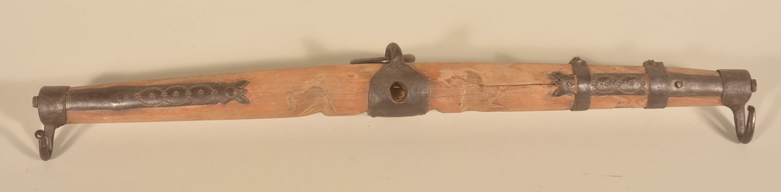 Early Yoke with Decorated Wrought Iron: An uncommon example of a common form found in Lancaster County. This example with wonderful punch-decorated iron braces, large hanging ring and iron hooks.19th century. 44"W