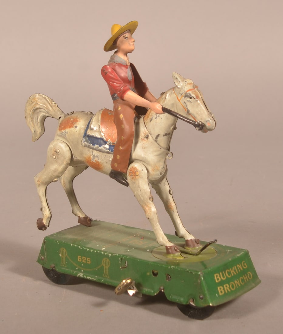Lehmann Wild West Bucking Bronco Clockwork Tin Toy: White horse variation with makers information on base. Patented 1906. 8"H