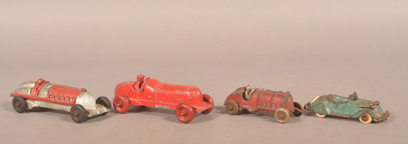 Group Hubley Cast Iron & Metal Racing Cars: 4 cars total including 3 racers and a blue convertible. 2 marked Hubley. Longest, 7 1/2"L