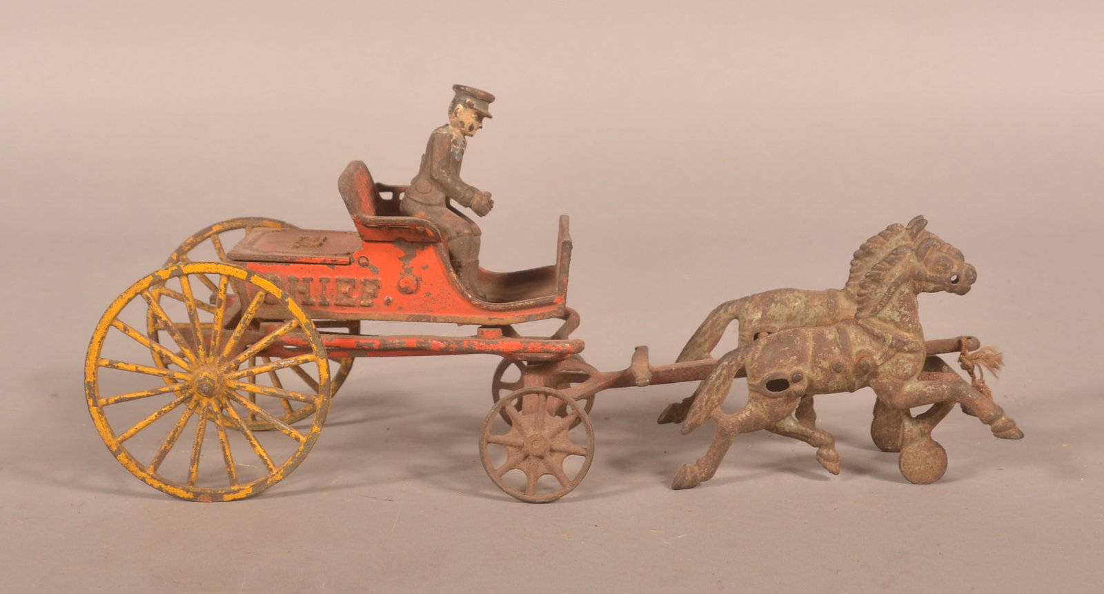 Hubley Cast Iron Fire Chief Horses & Wagon: Early toy featuring a double team of horses and a lift-lid compartment. 14 1/2"L