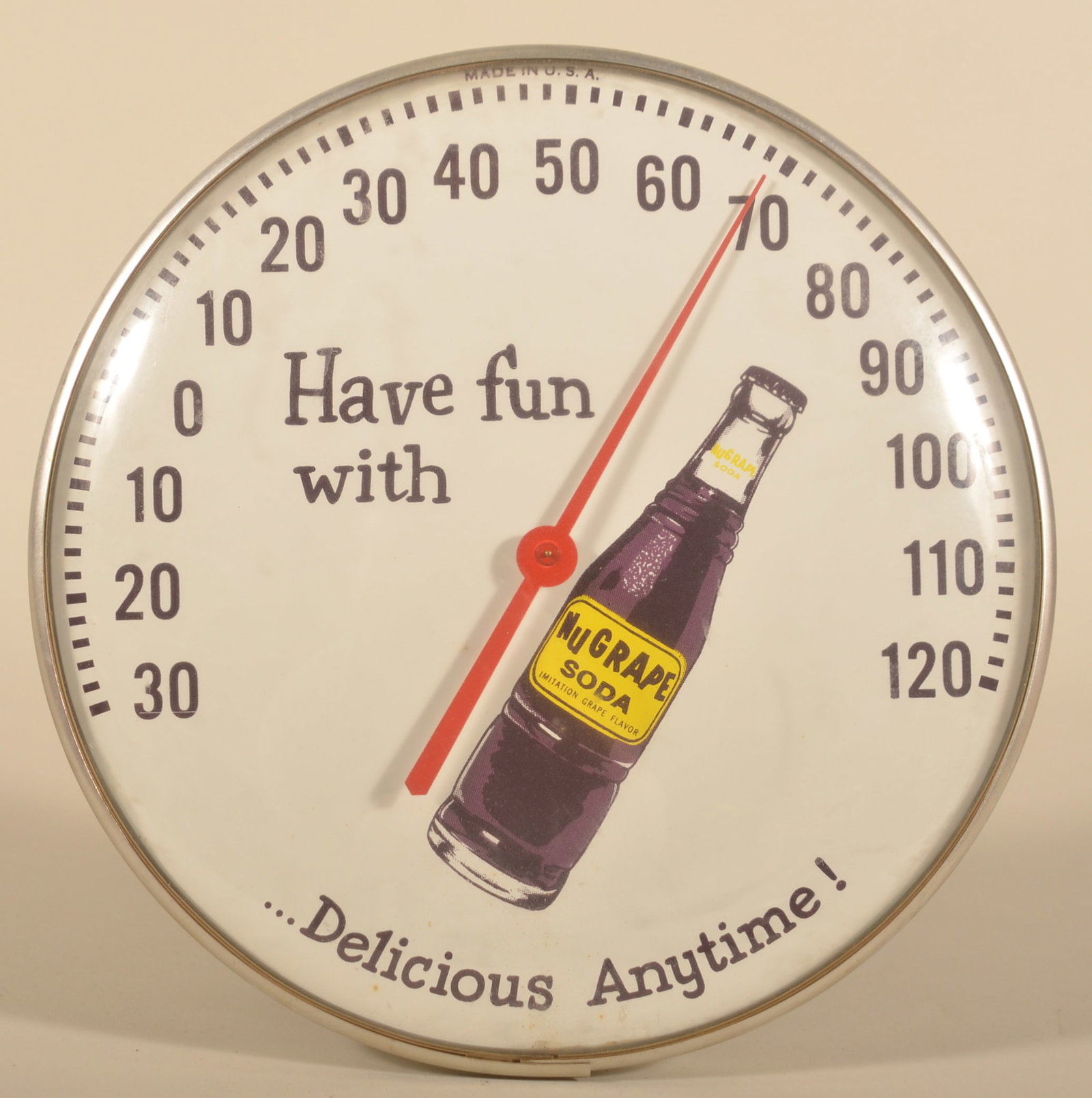NuGrape "Delicious Anytime" Soda Thermometer: Round, glass front thermometer marked Made in USA. 12 1/4"D