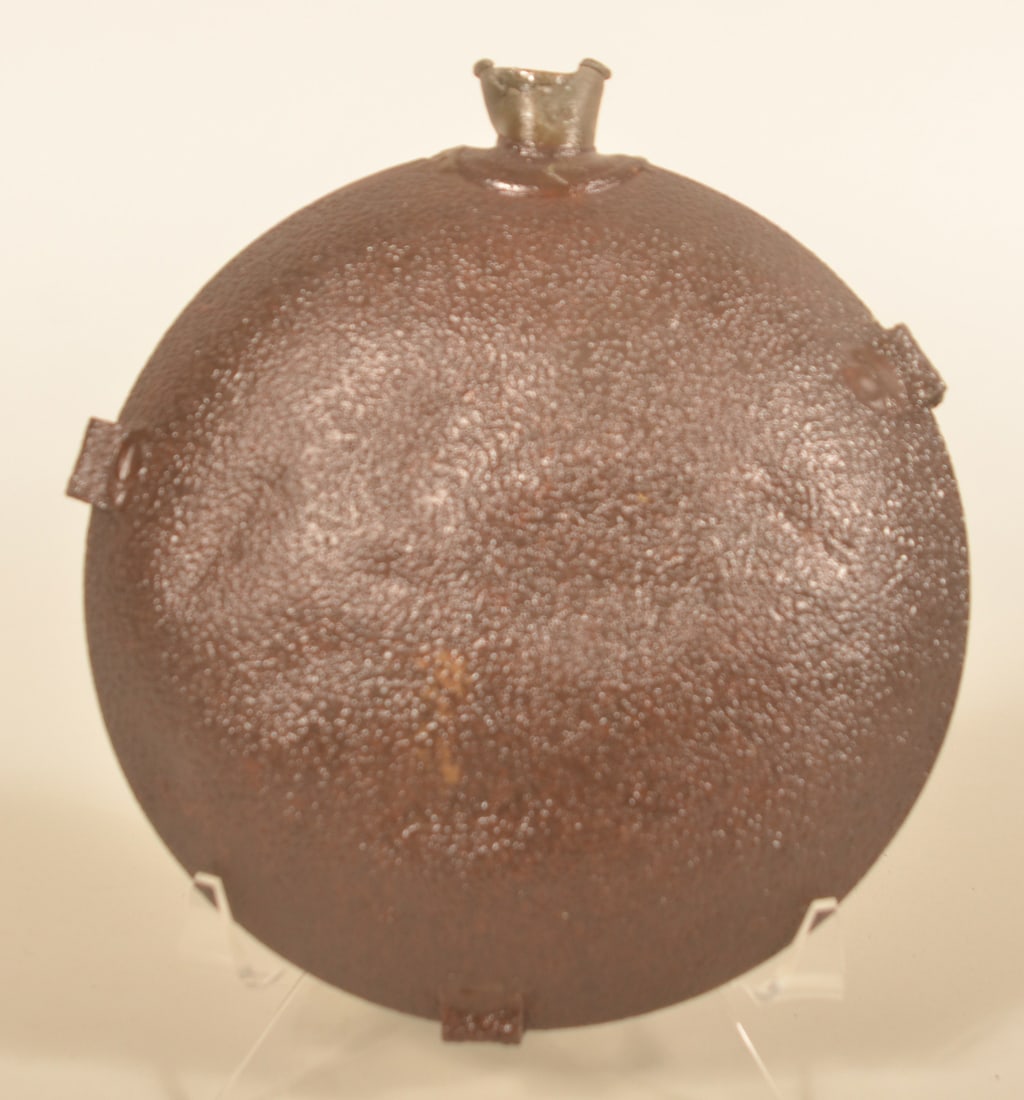 Dug US 1858 Smooth-Side Civil War Canteen: Smooth side canteen with pewter spout. Collector's note that it was dug near Antietam, MD. Provenance: The collection of Craig and Cynthia Wertz. 8 1/2"H