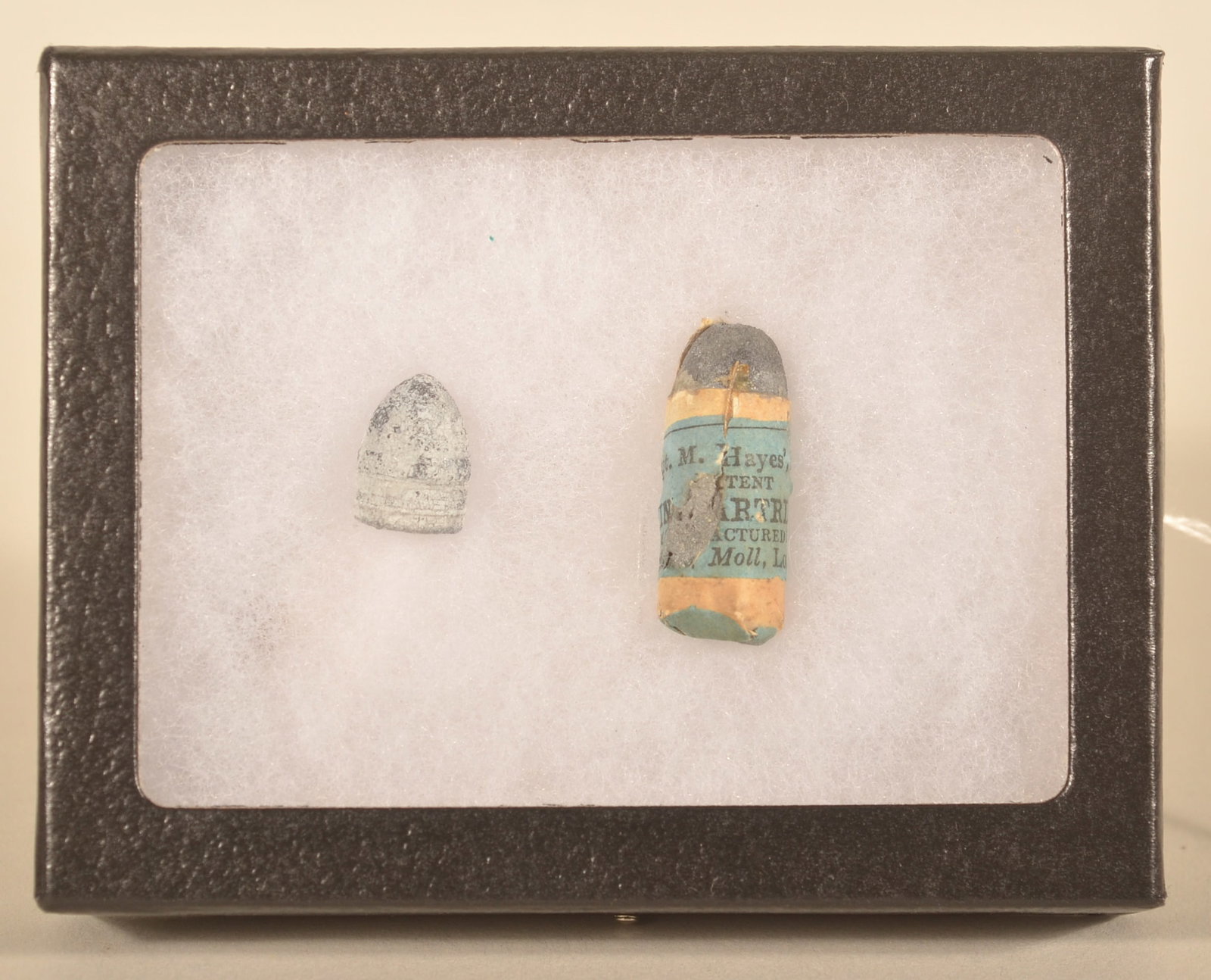 Rare Kerr .44 cal. Civil War English Cartridge: Unfired cartridge with blue label together with a relic example in a Riker case. Provenance: The collection of Craig and Cynthia Wertz. 1 1/4"L