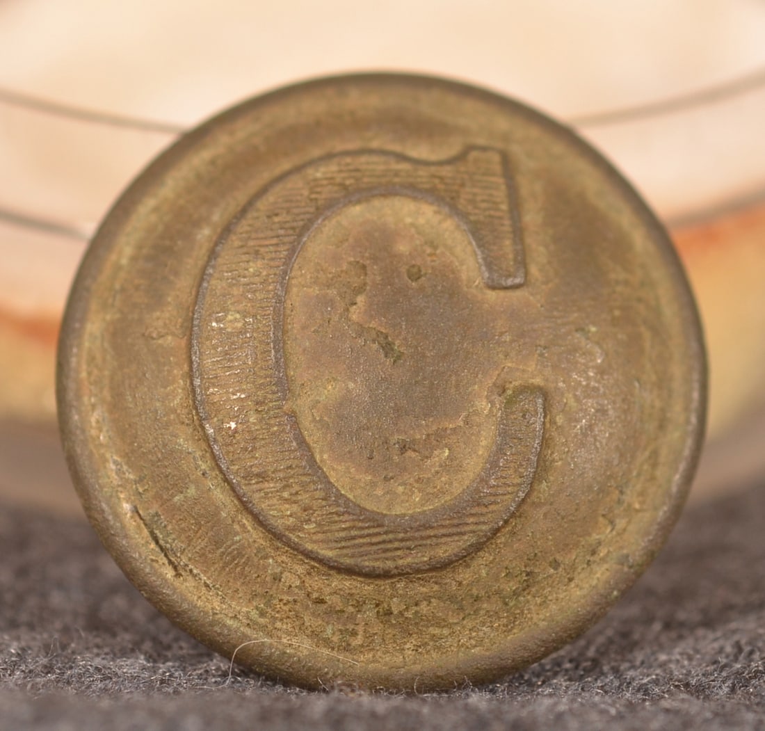 Dug Confederate Cavalry "C" Civil War Button: Very nice example with warm patina and shank is present. Marked "Superior Quality" on reverse. Provenance: The collection of Craig and Cynthia Wertz. 23 mm