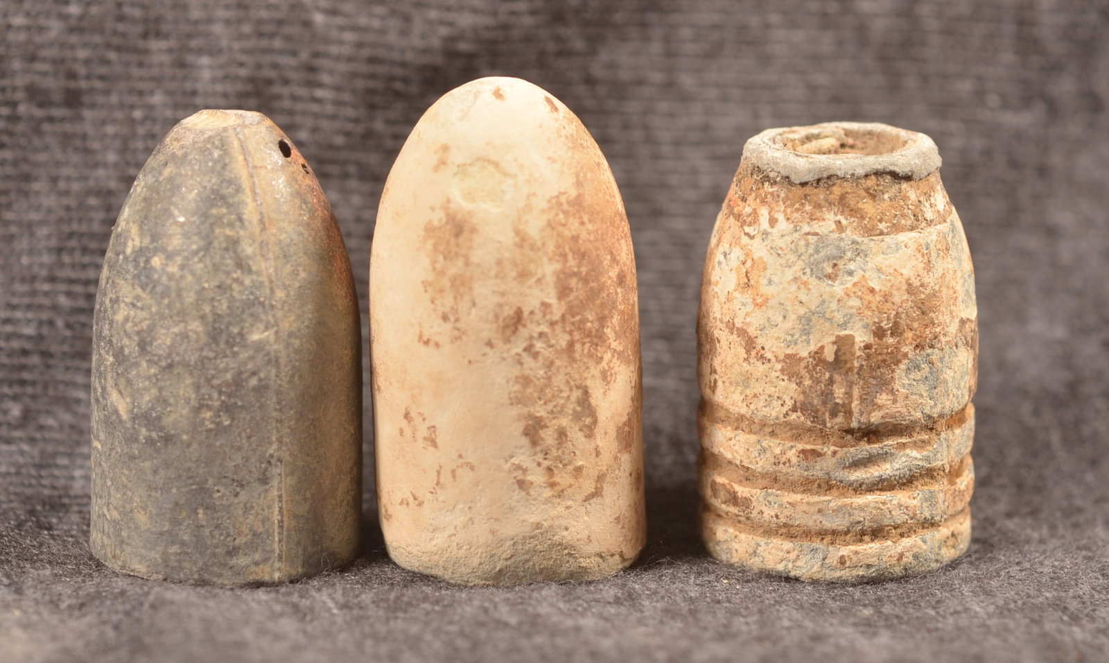 Great "Pulled" .58 cal. Bullet & Others: Lot of three bullets including a great .58 cal. rifle bullet that was lodged in the barrel and pulled with a worm. Group includes two .577 cal. Enfield rifle rounds including one Confederate example (