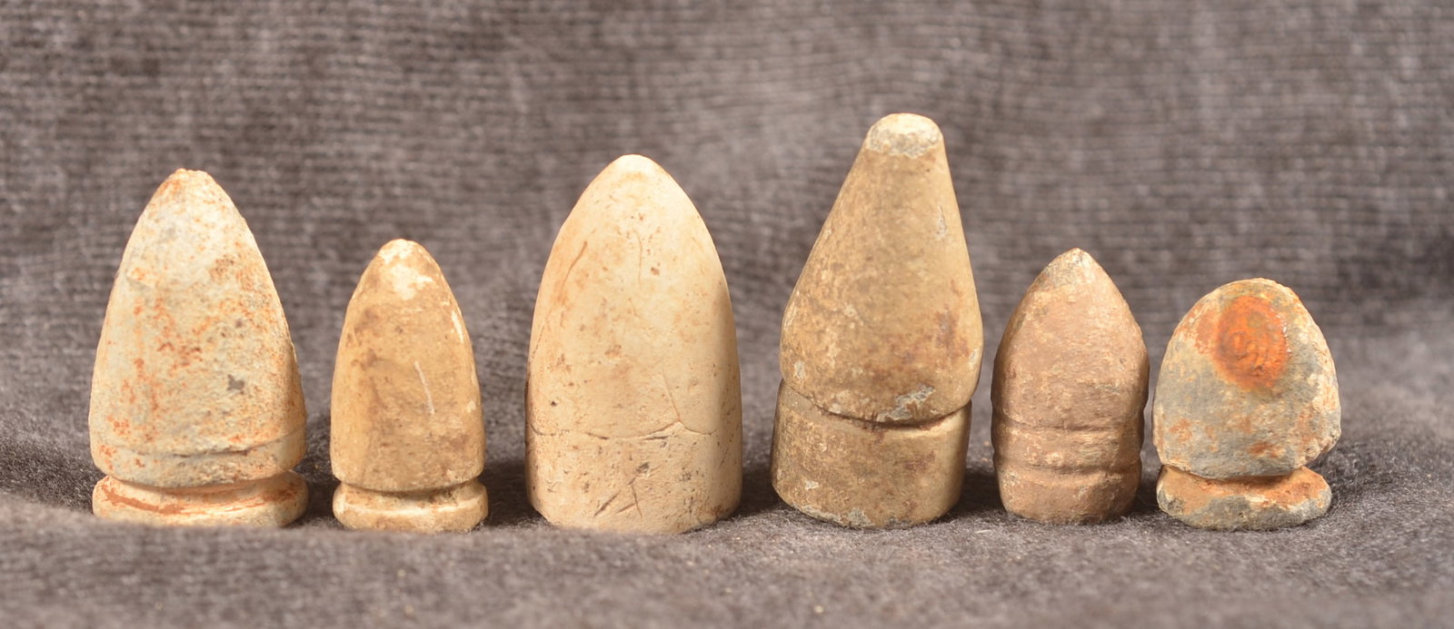 Civil War Revolver & Carbine Bullets: Group of original bullets including a Dimick bullet from Illinois. A .50 cal. Cosmopolitan Carbine bullet dug at Fort Donelson, a .37 cal. Maynard carbine bullet, dug .50 cal. Maynard bullet found at 