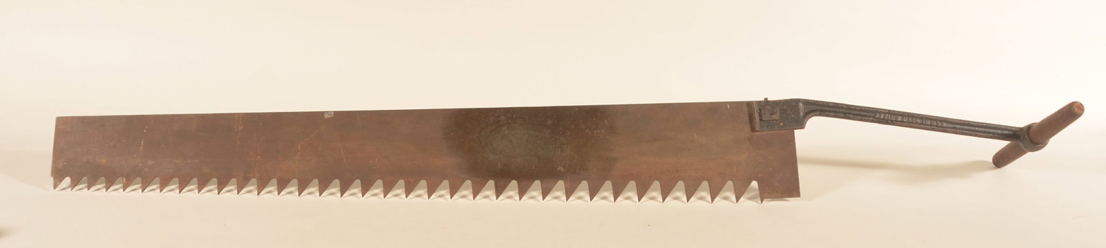 Large Atkins Ice Saw: Steel blade with faint maker's mark. Cast iron handle marked "Atkins Made In USA". 64"L