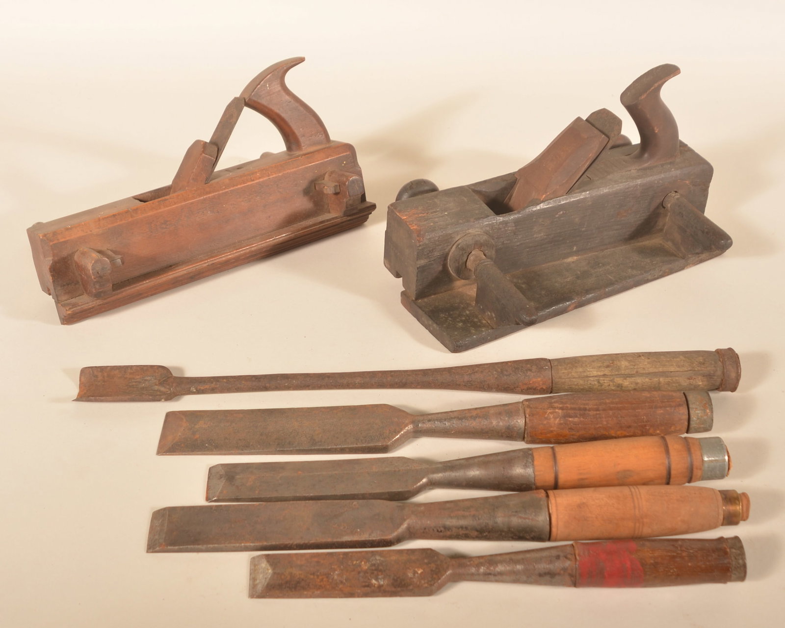 Group Antique Woodworking Tools: Group consists of two English planes, one signed "Greaves and Sons" and the other signed in part "Made From Butchers Cast Steel". One gouge and four chisels. One of the chisels stamped "D Bolton" twic